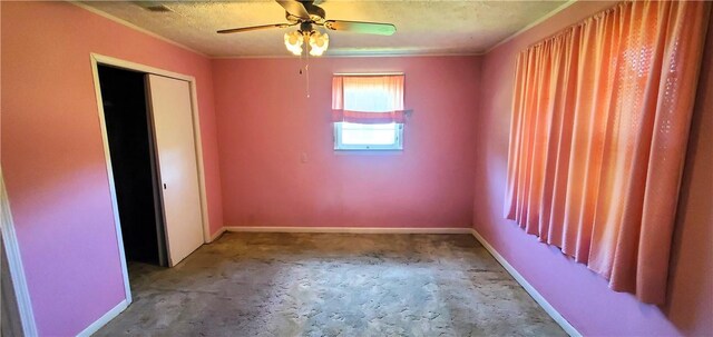 unfurnished room with a textured ceiling and ceiling fan