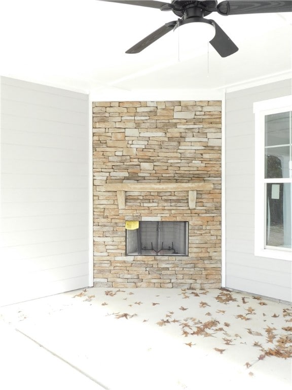 interior details with a fireplace and wooden walls