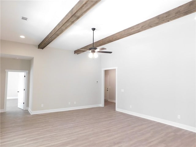 unfurnished room with ceiling fan, beam ceiling, and light wood-type flooring