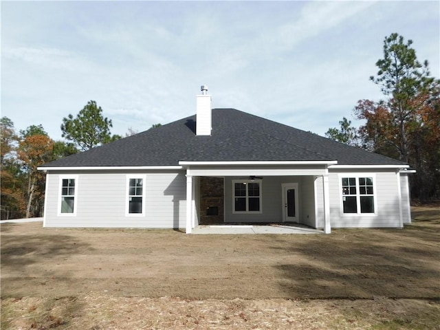 back of house with a patio