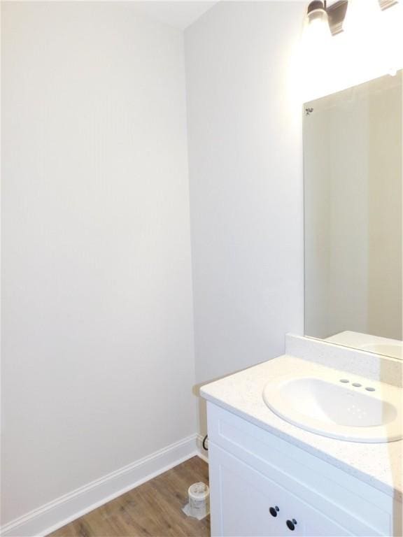 bathroom featuring hardwood / wood-style floors and vanity