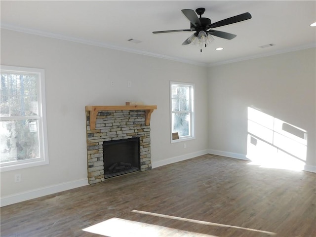 unfurnished living room with ceiling fan, wood-type flooring, a fireplace, and crown molding