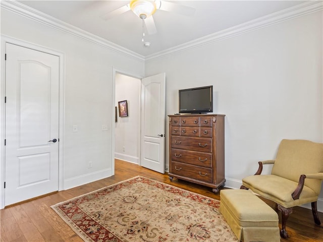 1655 Alex Ave, Auburn, AL 36030 - sitting room with wood finished floors, crown molding, a ceiling fan, and baseboards