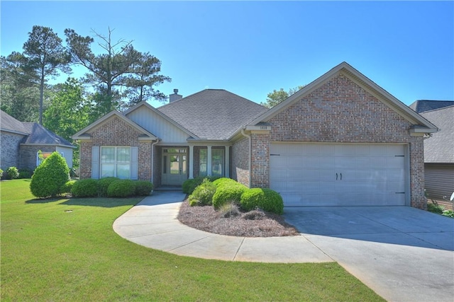 view of front of home with a garage and a front yard