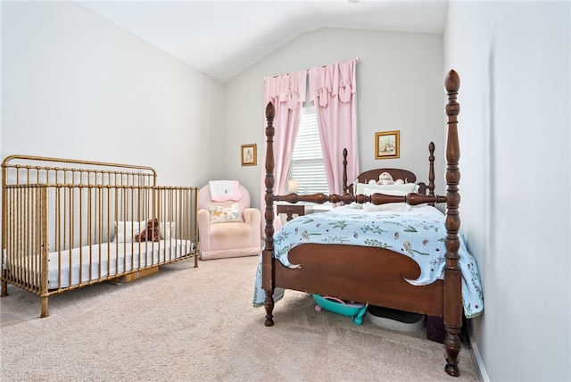 carpeted bedroom featuring vaulted ceiling