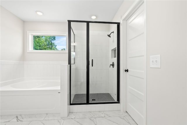 750 Mcdonald Dr, Opelika, AL 36801 - bathroom featuring marble look tile flooring, a bath, a stall shower, and recessed lighting
