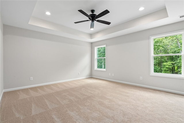 750 Mcdonald Dr, Opelika, AL 36801 - spare room with a raised ceiling, light carpet, recessed lighting, and a ceiling fan