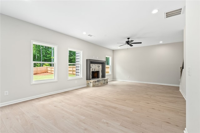 750 Mcdonald Dr, Opelika, AL 36801 - unfurnished living room featuring ceiling fan, light wood finished floors, recessed lighting, and a fireplace
