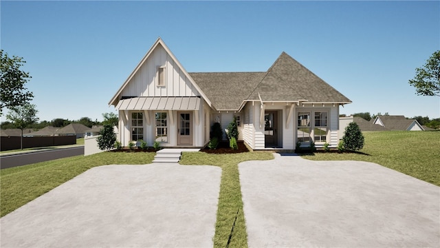 modern farmhouse featuring a porch and a front yard