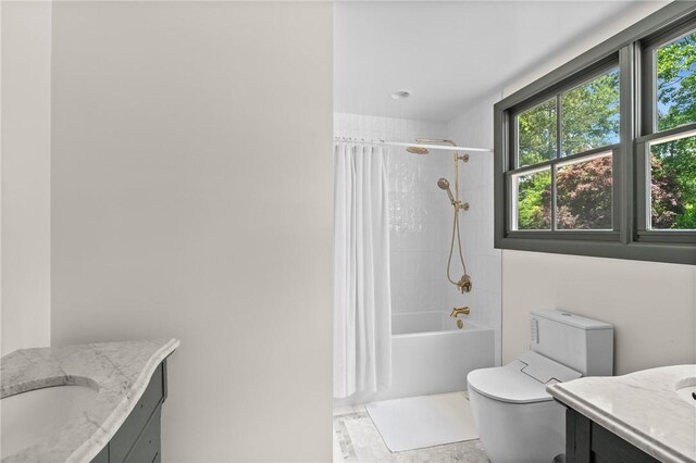 613 5th Ave, Opelika, AL 36801 - bathroom featuring vanity, toilet, and shower / bathtub combination with curtain