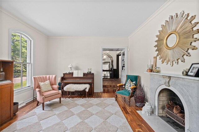 613 5th Ave, Opelika, AL 36801 - living area featuring wood finished floors, ornamental molding, plenty of natural light, and baseboards