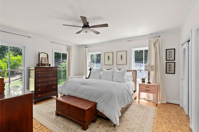 613 5th Ave, Opelika, AL 36801 - bedroom featuring multiple windows, ornamental molding, baseboards, and a ceiling fan