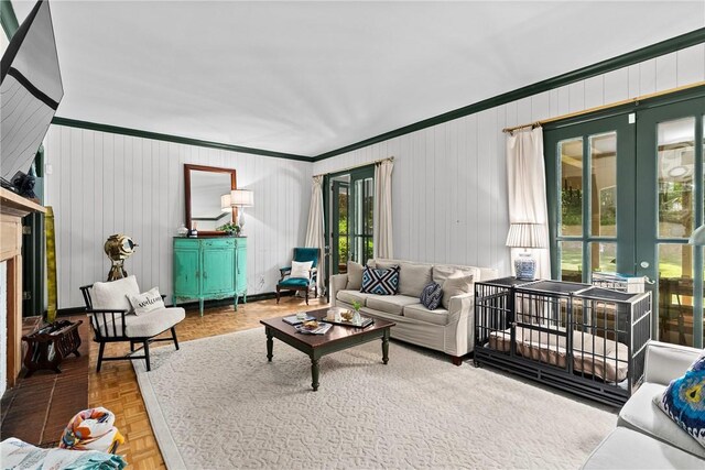 613 5th Ave, Opelika, AL 36801 - living area with crown molding, french doors, a fireplace, and baseboards