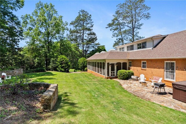 613 5th Ave, Opelika, AL 36801 - view of green lawn featuring a patio area and a sunroom