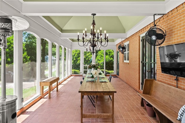 613 5th Ave, Opelika, AL 36801 - sunroom featuring brick patterned floors, a chandelier, and vaulted ceiling