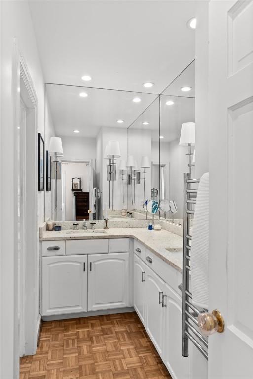 613 5th Ave, Opelika, AL 36801 - bathroom with vanity, recessed lighting, and radiator