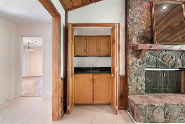 158 Alice Cir, Auburn, AL 36830 - kitchen featuring dark countertops, light wood-style flooring, and a chandelier