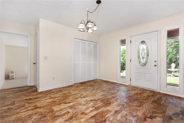 158 Alice Cir, Auburn, AL 36830 - entrance foyer with a chandelier and baseboards