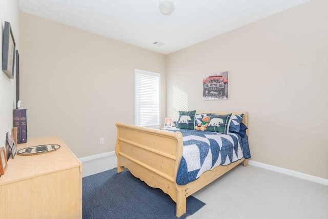 bedroom with carpet, visible vents, and baseboards