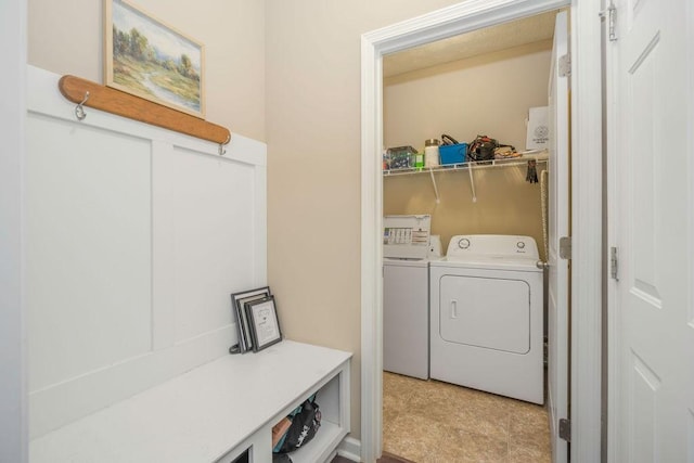 washroom featuring laundry area and washer and clothes dryer