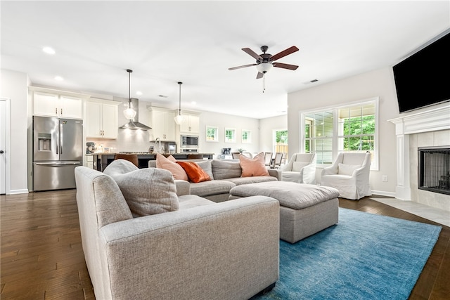 1803 Solamere Ct, Auburn, AL 36832 - living room featuring recessed lighting, plenty of natural light, dark wood-type flooring, a ceiling fan, and a tiled fireplace