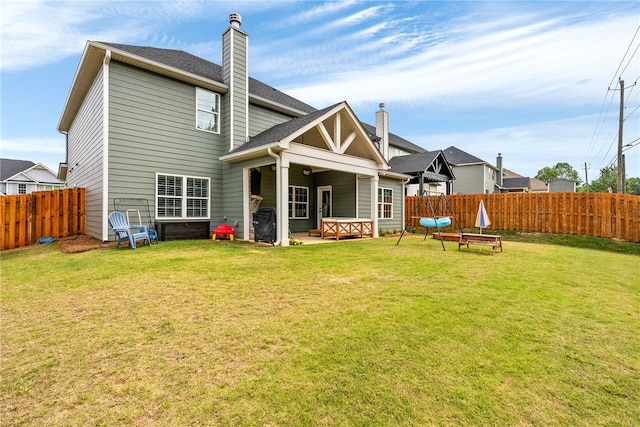 1803 Solamere Ct, Auburn, AL 36832 - rear view of house with a chimney and a patio area