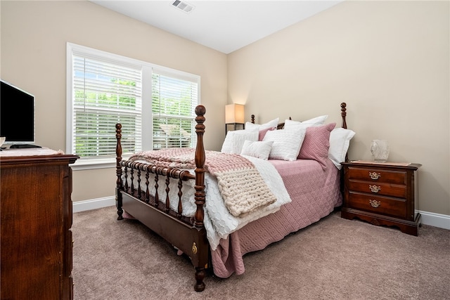 carpeted bedroom with baseboards