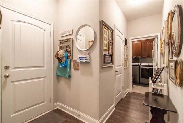 doorway to outside featuring washing machine and dryer and dark hardwood / wood-style floors