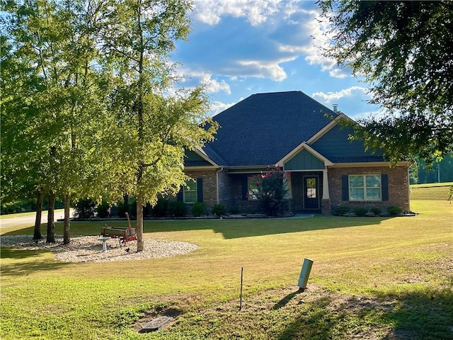 craftsman-style home featuring a front lawn