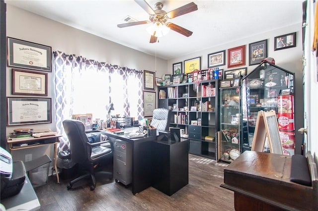 home office featuring ceiling fan and dark wood-type flooring