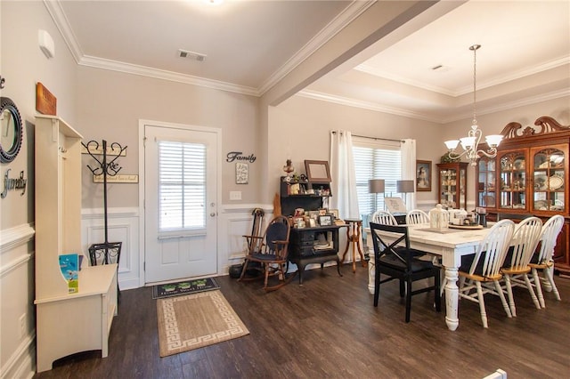 dining space with a chandelier, dark hardwood / wood-style floors, and ornamental molding