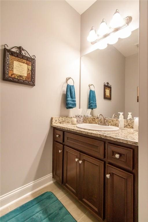 bathroom featuring tile patterned flooring and vanity