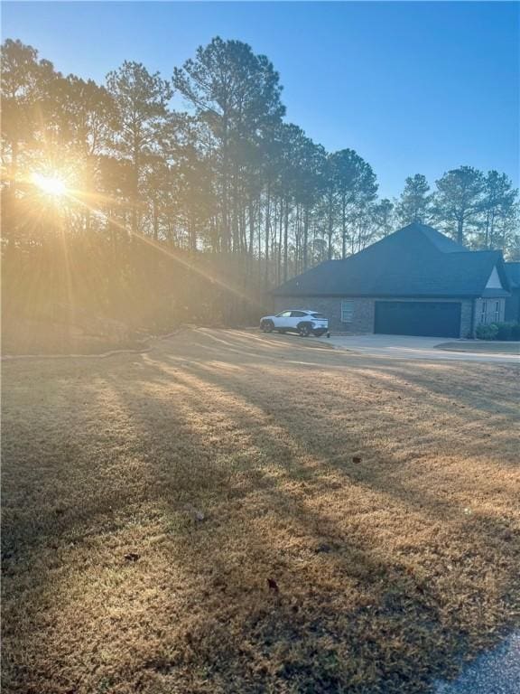 view of yard featuring a garage