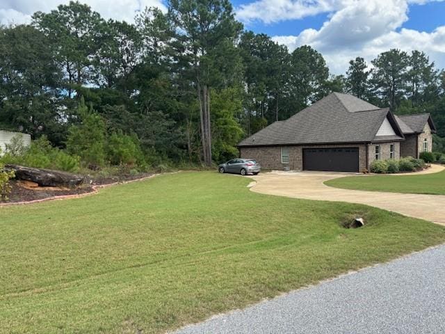 view of home's exterior featuring a garage, a lawn, concrete driveway, and brick siding