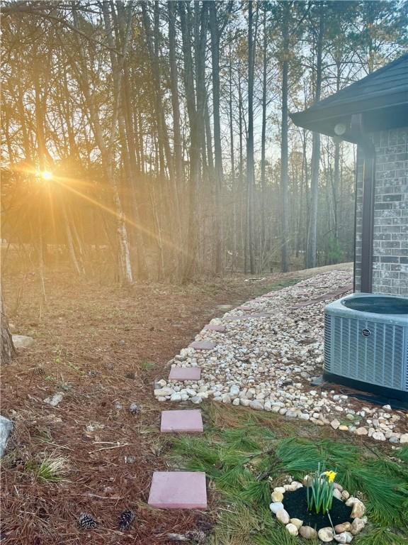 view of yard with central AC