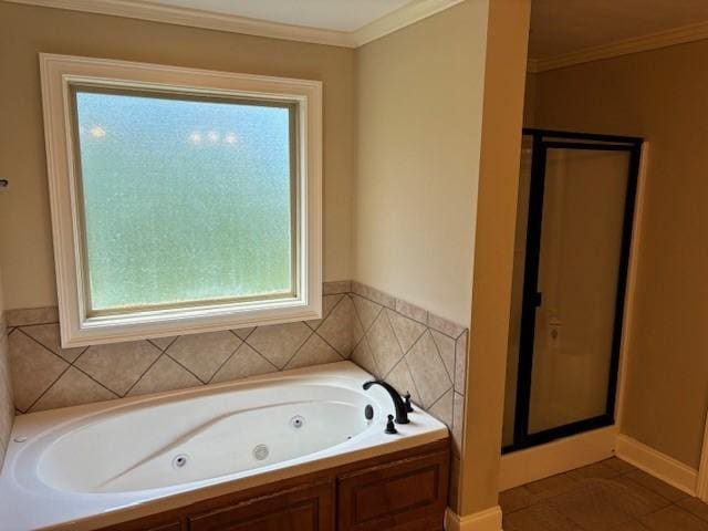 full bath featuring ornamental molding, a wealth of natural light, a shower stall, and a tub with jets