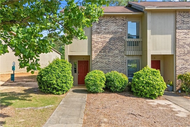 multi unit property featuring brick siding