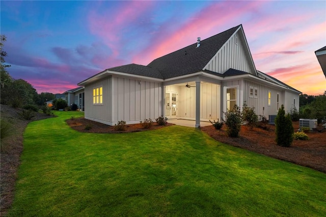 3547 Eagle Trl, Opelika, AL 36801 - back of property featuring board and batten siding, a lawn, a ceiling fan, french doors, and central AC