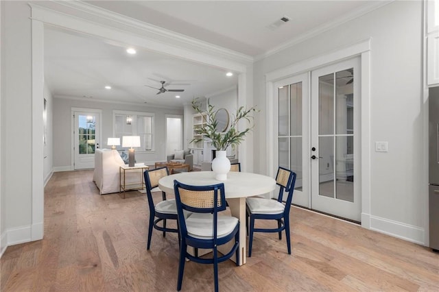 3547 Eagle Trl, Opelika, AL 36801 - dining space with french doors, light wood-style flooring, ornamental molding, baseboards, and recessed lighting