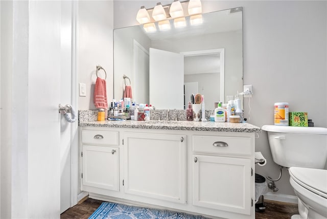 1041 Stonegate Dr Unit C, Auburn, AL 36830 - bathroom featuring toilet, vanity, and wood finished floors