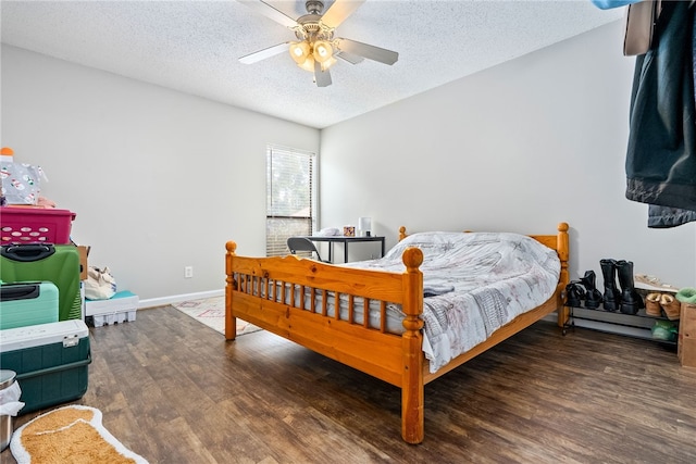 1041 Stonegate Dr Unit C, Auburn, AL 36830 - bedroom featuring wood finished floors, a textured ceiling, baseboards, and a ceiling fan