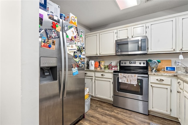 1041 Stonegate Dr Unit C, Auburn, AL 36830 - kitchen featuring stainless steel appliances, light countertops, dark wood-style floors, and white cabinetry