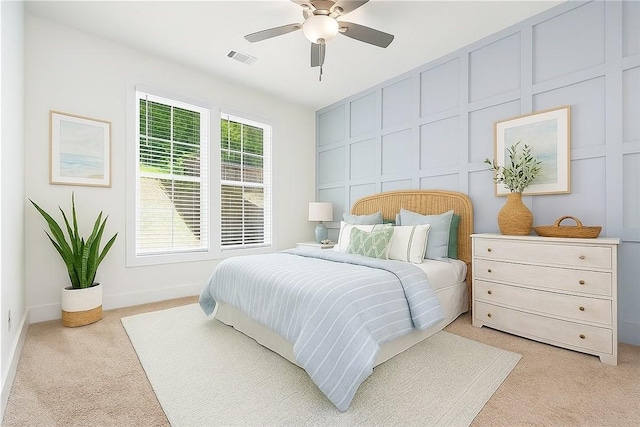 854 Village Dr, Opelika, AL 36801 - bedroom featuring light carpet, a decorative wall, and ceiling fan