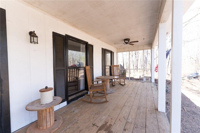 deck with a porch and ceiling fan