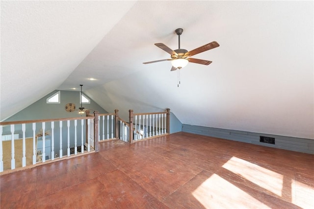 additional living space featuring lofted ceiling, hardwood / wood-style floors, and ceiling fan