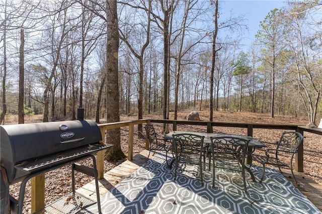 wooden terrace featuring grilling area