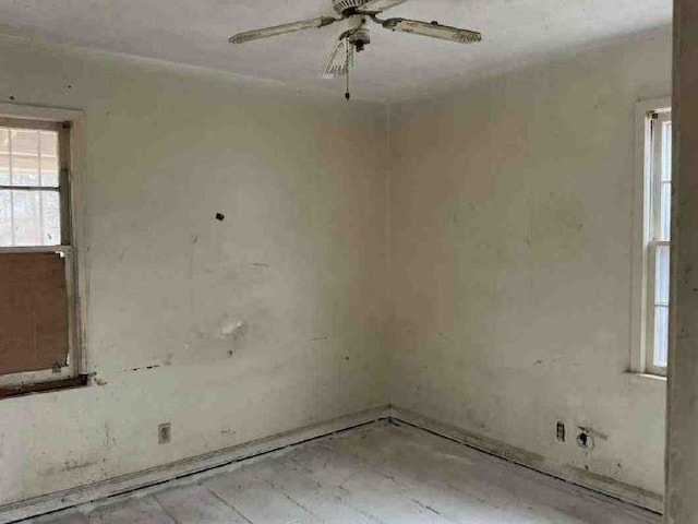 unfurnished room with ceiling fan