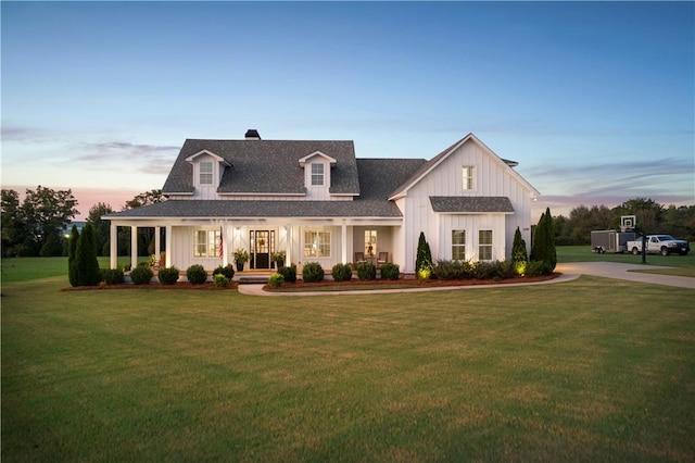 view of front of home featuring a yard and a porch