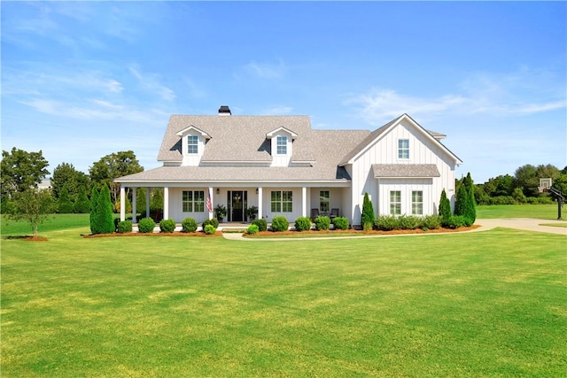 view of front of house featuring covered porch and a front yard