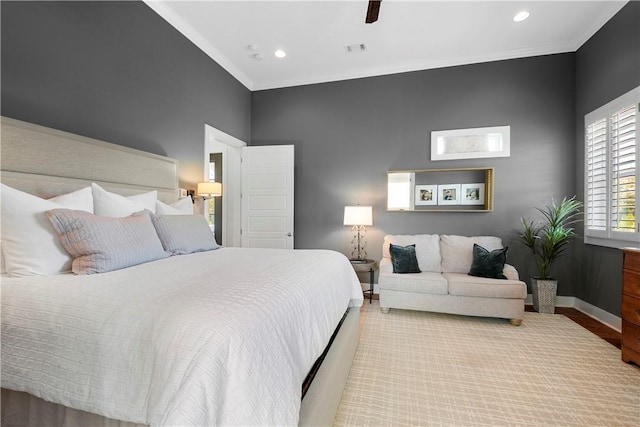 bedroom with light hardwood / wood-style flooring, ceiling fan, and crown molding